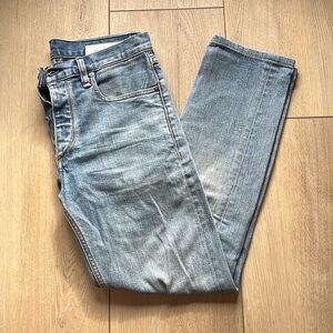Men’s slim light wash rag and bone jeans.